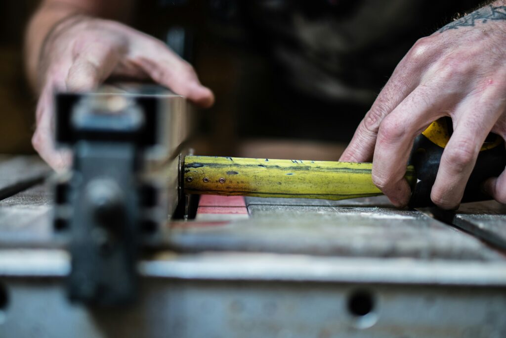 A person measuring something with a tape measure